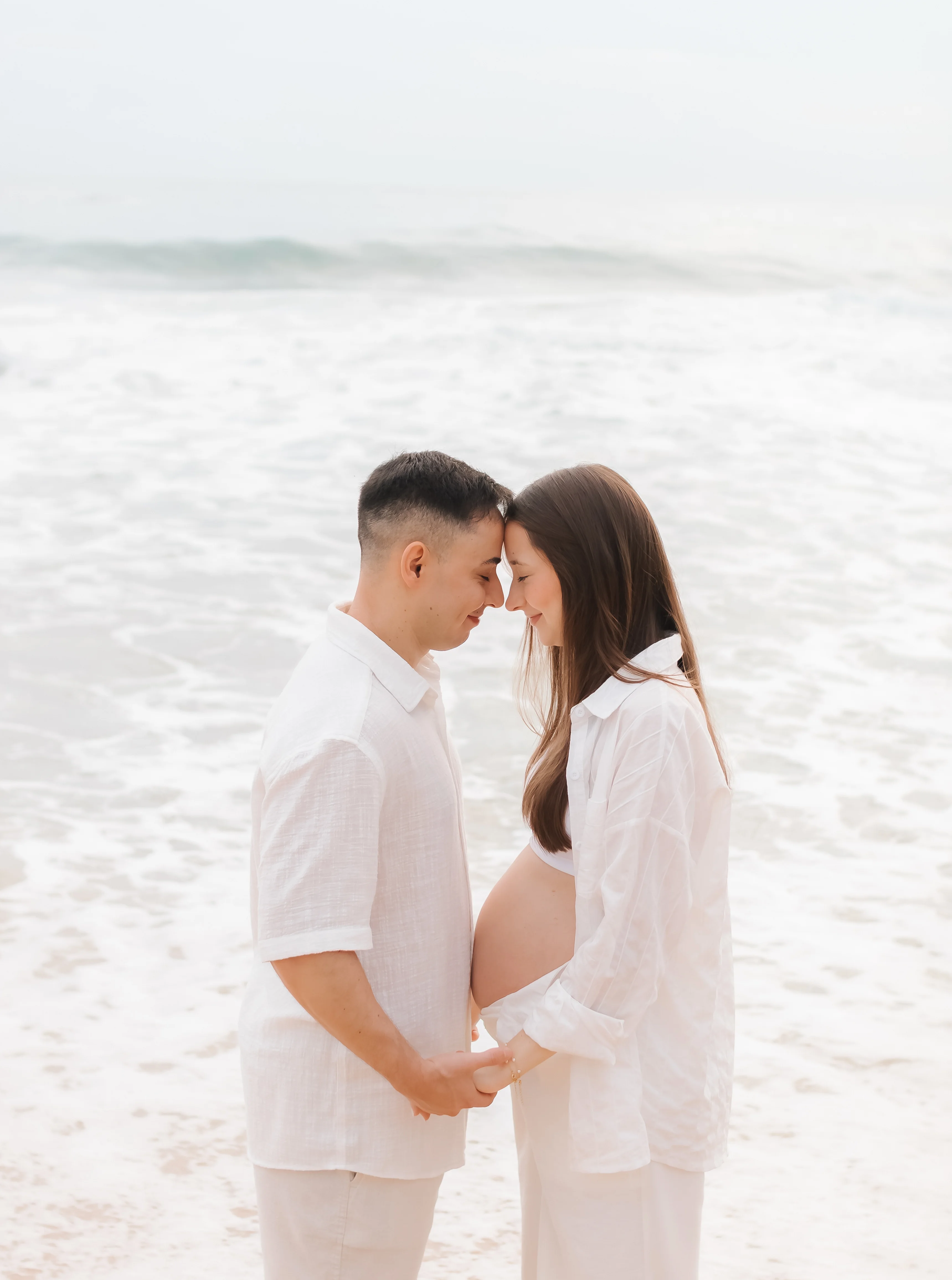 Casal gestante na praia